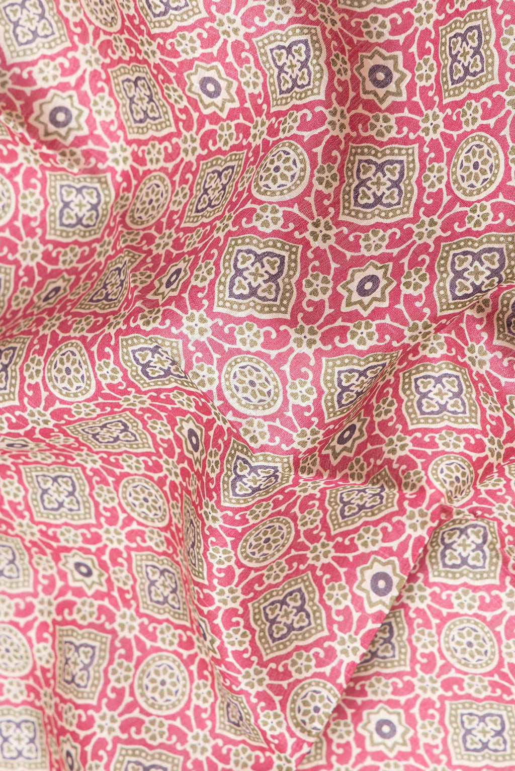 Close up of Magenta Dual Tone Tussar Silk Saree with Printed design on the body and Zari Border.  displaying folds