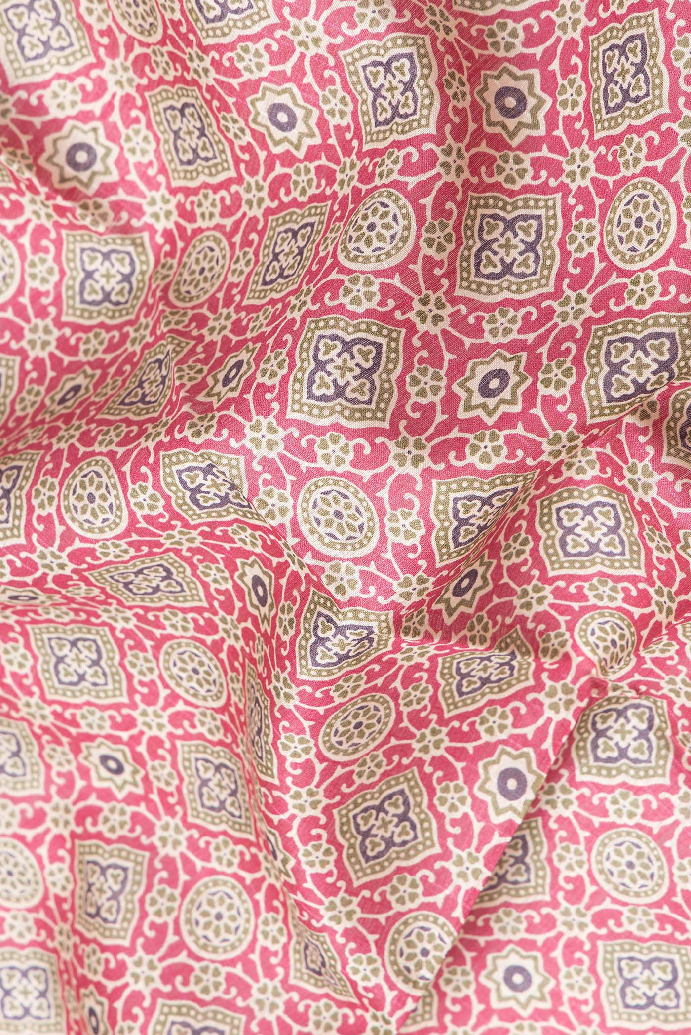 Close up of Magenta Dual Tone Tussar Silk Saree with Printed design on the body and Zari Border.  displaying folds