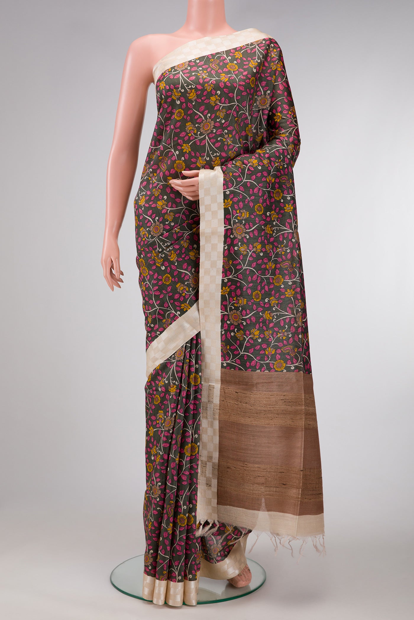 Bottle Green Dual Tone Tussar Silk Saree with Printed design on the body and Checks Border.  displayed on a mannequin