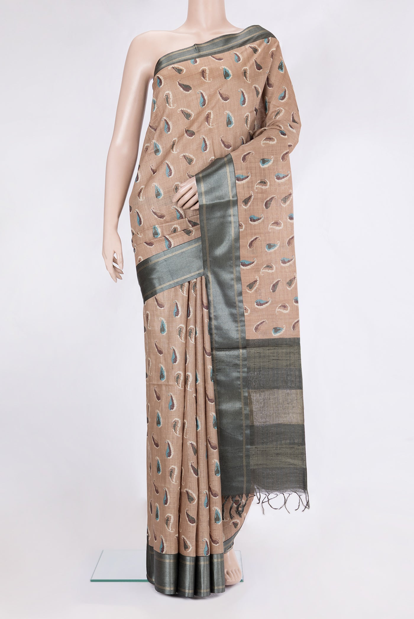 Beige Tussar Silk Saree with Stripes on the body and Zari Border.  displayed on a mannequin