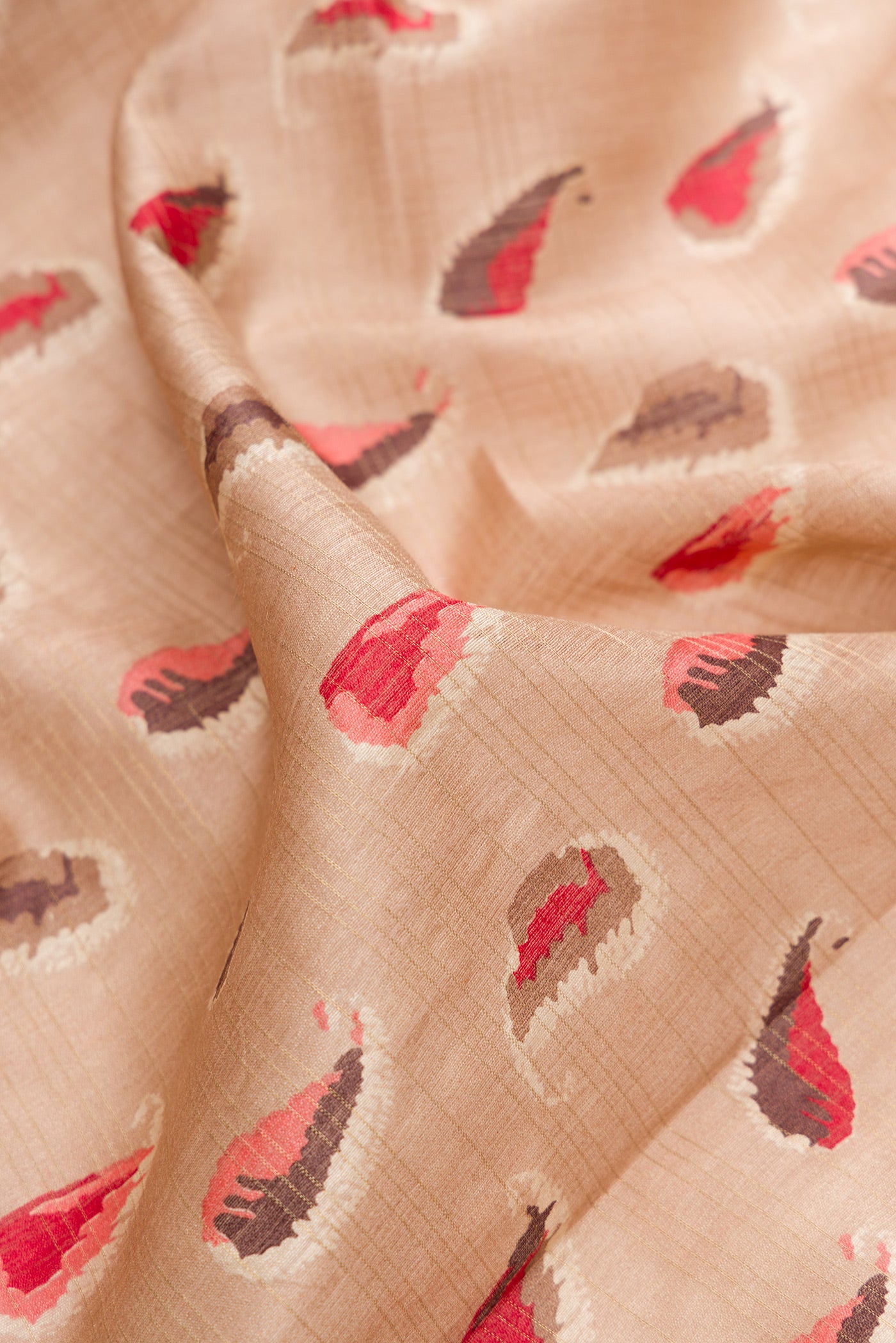 Close up of Beige Dual Tone Tussar Silk Saree with Printed design on the body and Zari Border.  displaying folds