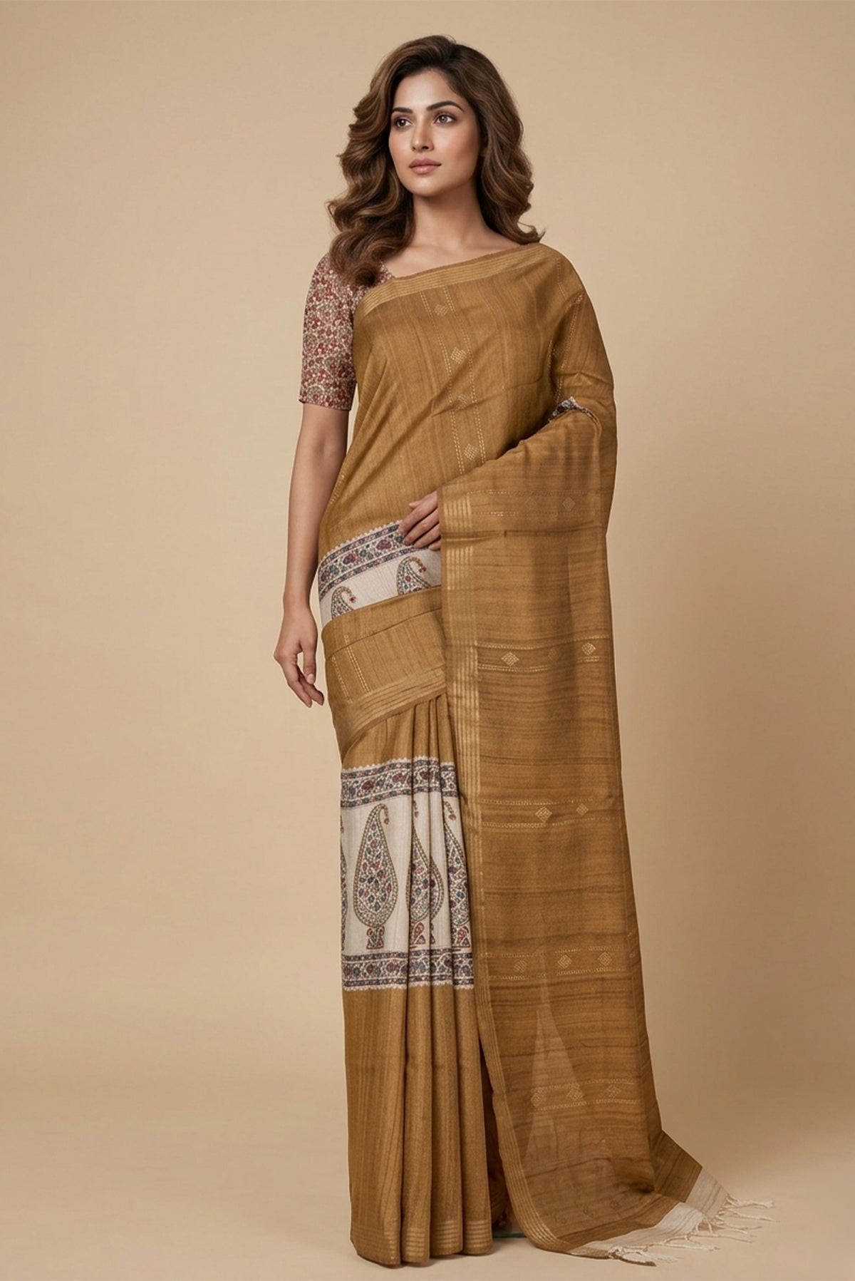Model wearing a Brown Tussar Silk Saree with Printed design on the body and Zari Border.