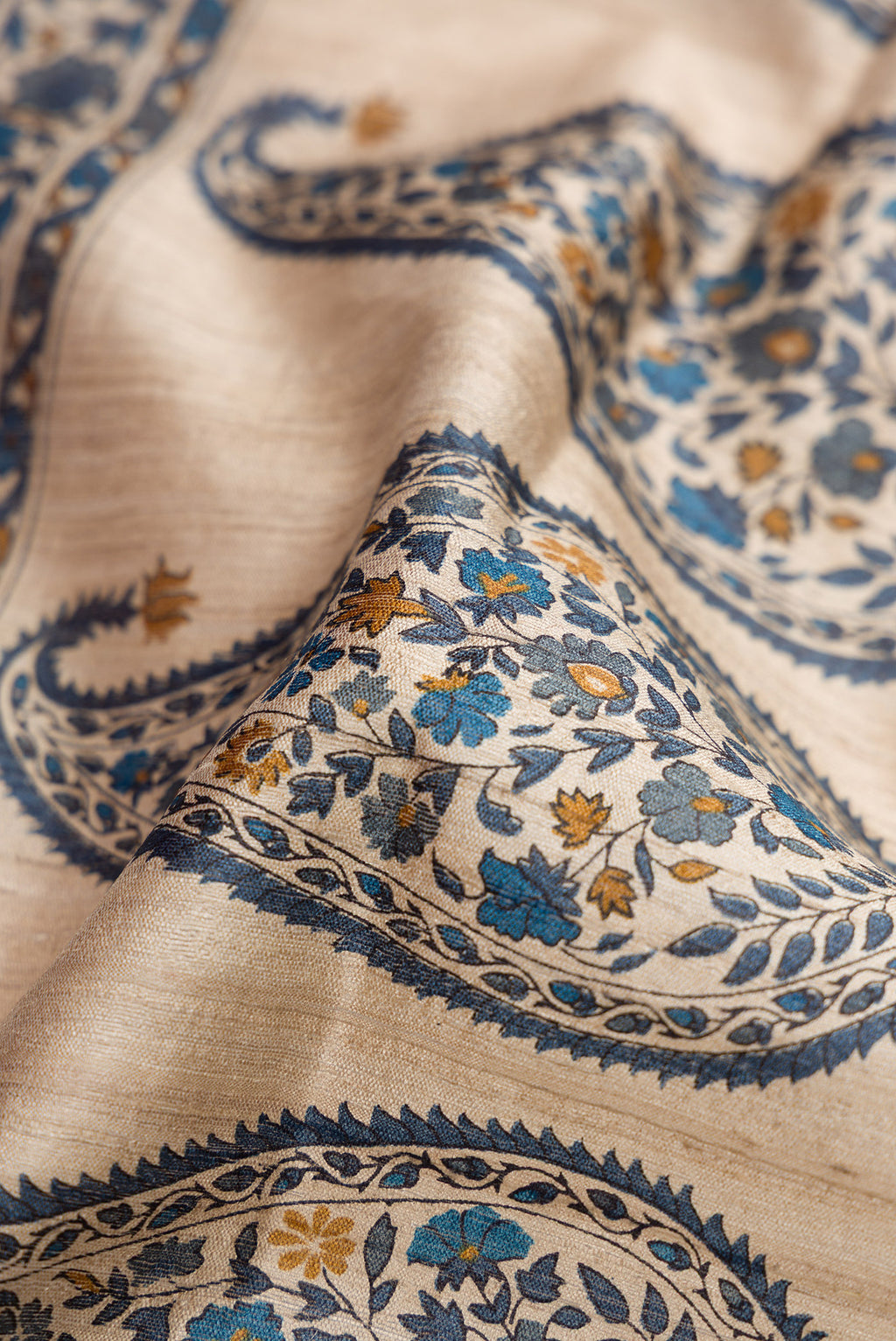 Close up of Blue Grey Dual Tone Tussar Silk Saree with Stripes on the body and Zari Border.  displaying folds