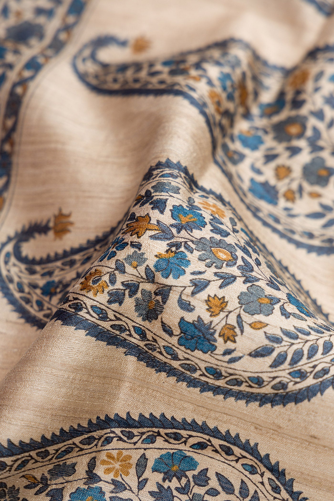 Close up of Blue Grey Dual Tone Tussar Silk Saree with Stripes on the body and Zari Border.  displaying folds
