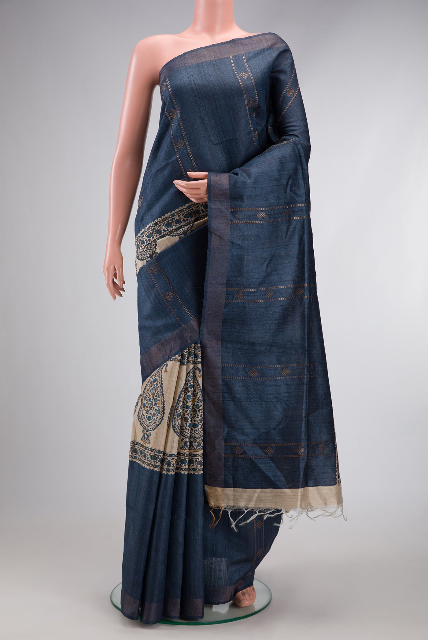 Blue Grey Dual Tone Tussar Silk Saree with Stripes on the body and Zari Border.  displayed on a mannequin