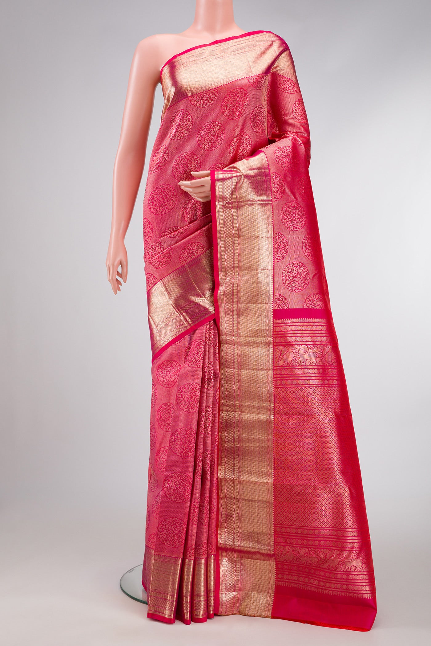 Pink Dual Tone Kanchipuram Silk Saree with Zari Butta on the body and Zari Border.  displayed on a mannequin