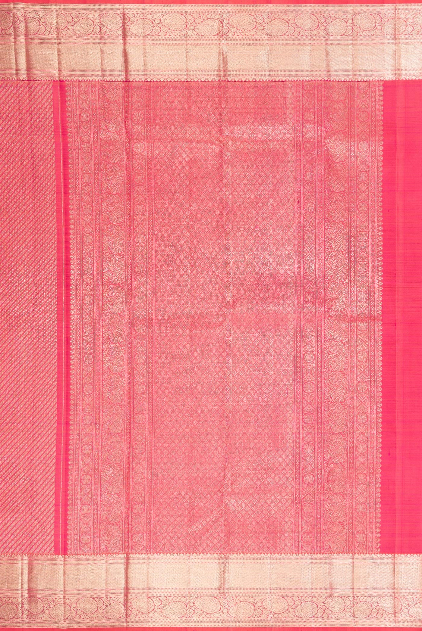 Close up image of the pallu of Orange Dual Tone Kanchipuram Silk Saree with Zari Brocade on the body and Zari Border. 