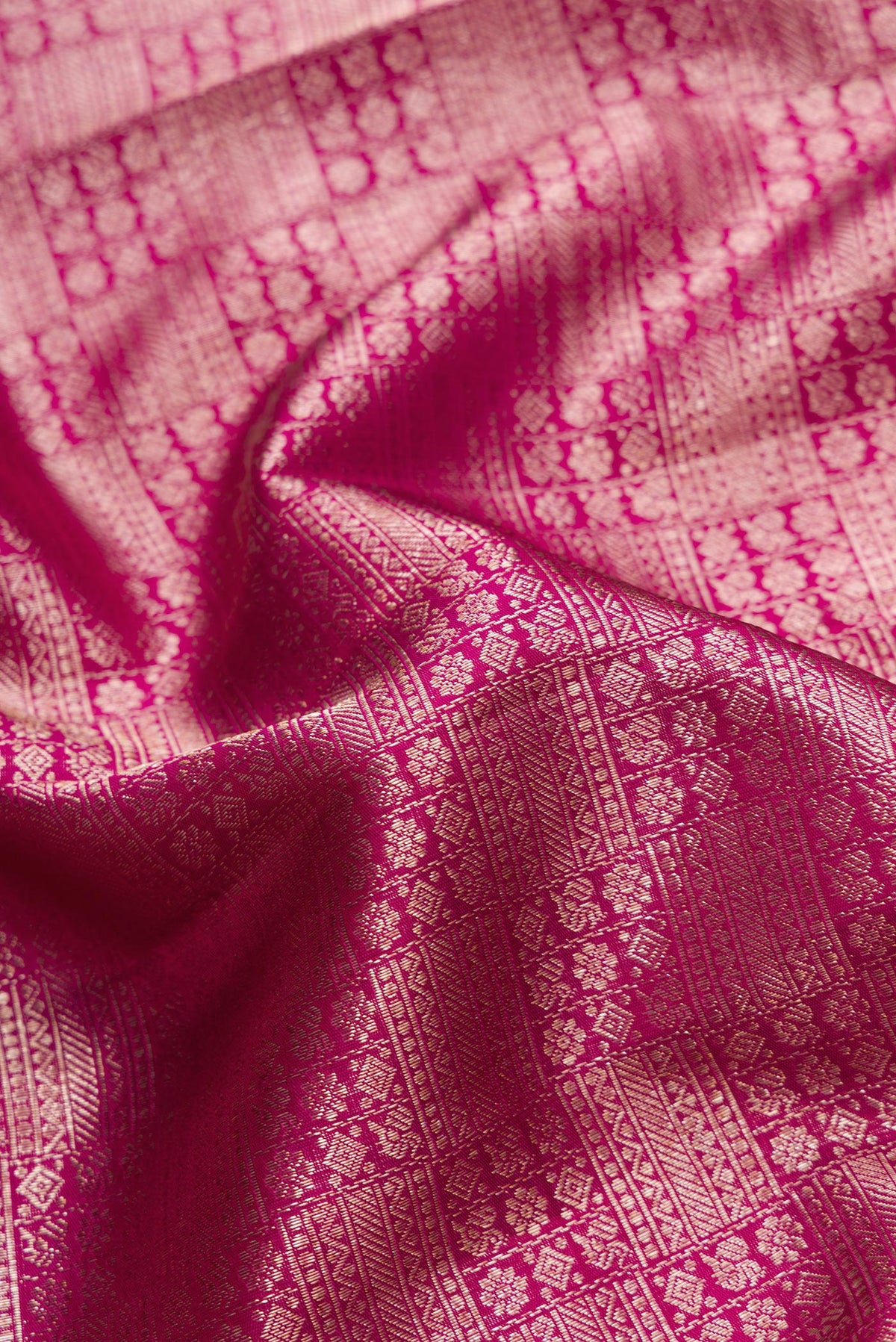 Close up of Purple Dual Tone Kanchipuram Silk Saree with Zari Brocade on the body and Zari Border.  displaying folds