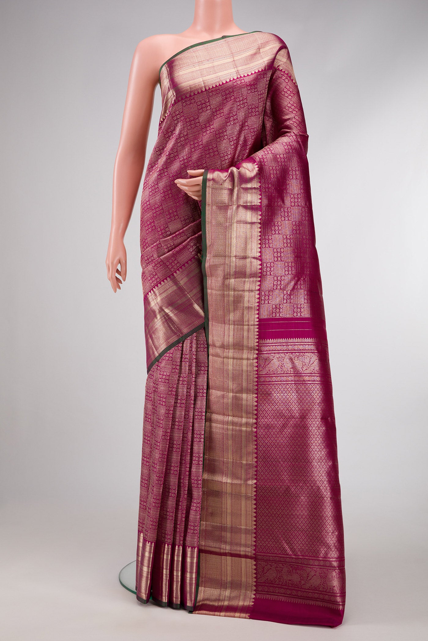 Purple Dual Tone Kanchipuram Silk Saree with Zari Brocade on the body and Zari Border.  displayed on a mannequin