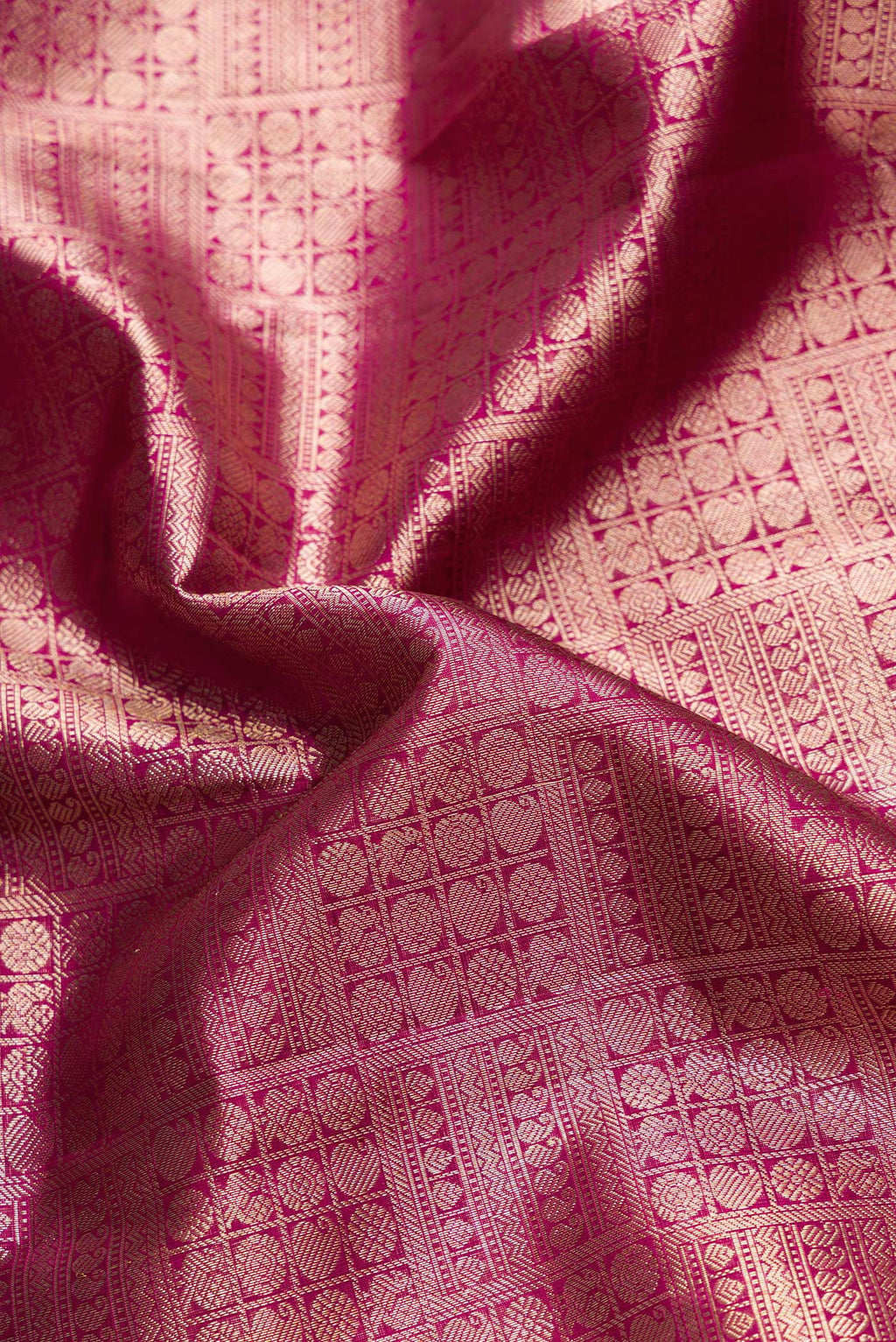 Close up of Purple Dual Tone Kanchipuram Silk Saree with Zari Brocade on the body and Zari Border.  displaying folds