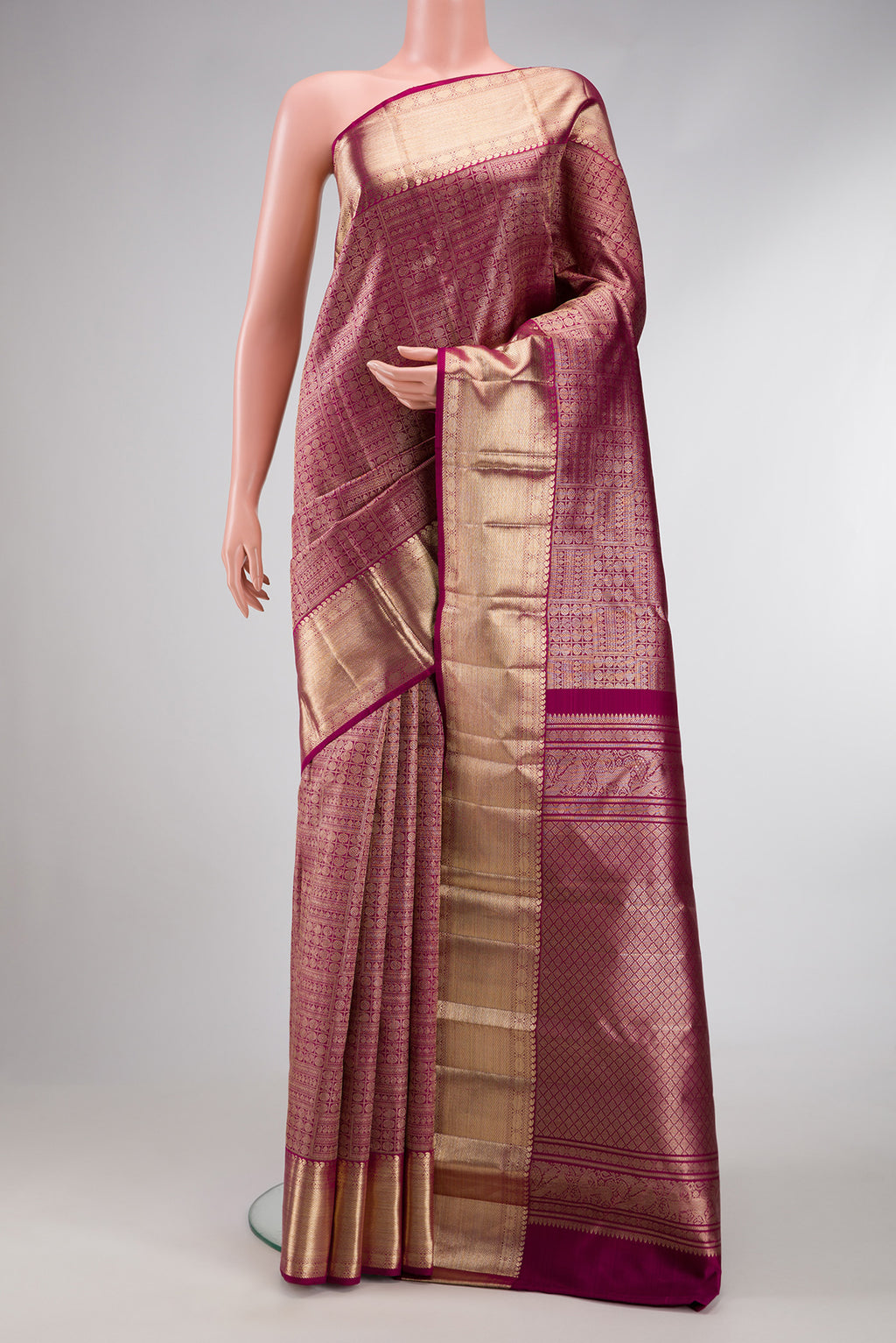 Purple Dual Tone Kanchipuram Silk Saree with Zari Brocade on the body and Zari Border.  displayed on a mannequin