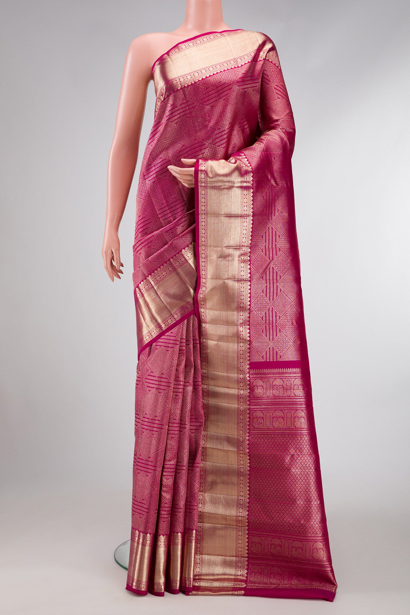 Magenta Dual Tone Kanchipuram Silk Saree with Zari Brocade on the body and Zari Border.  displayed on a mannequin