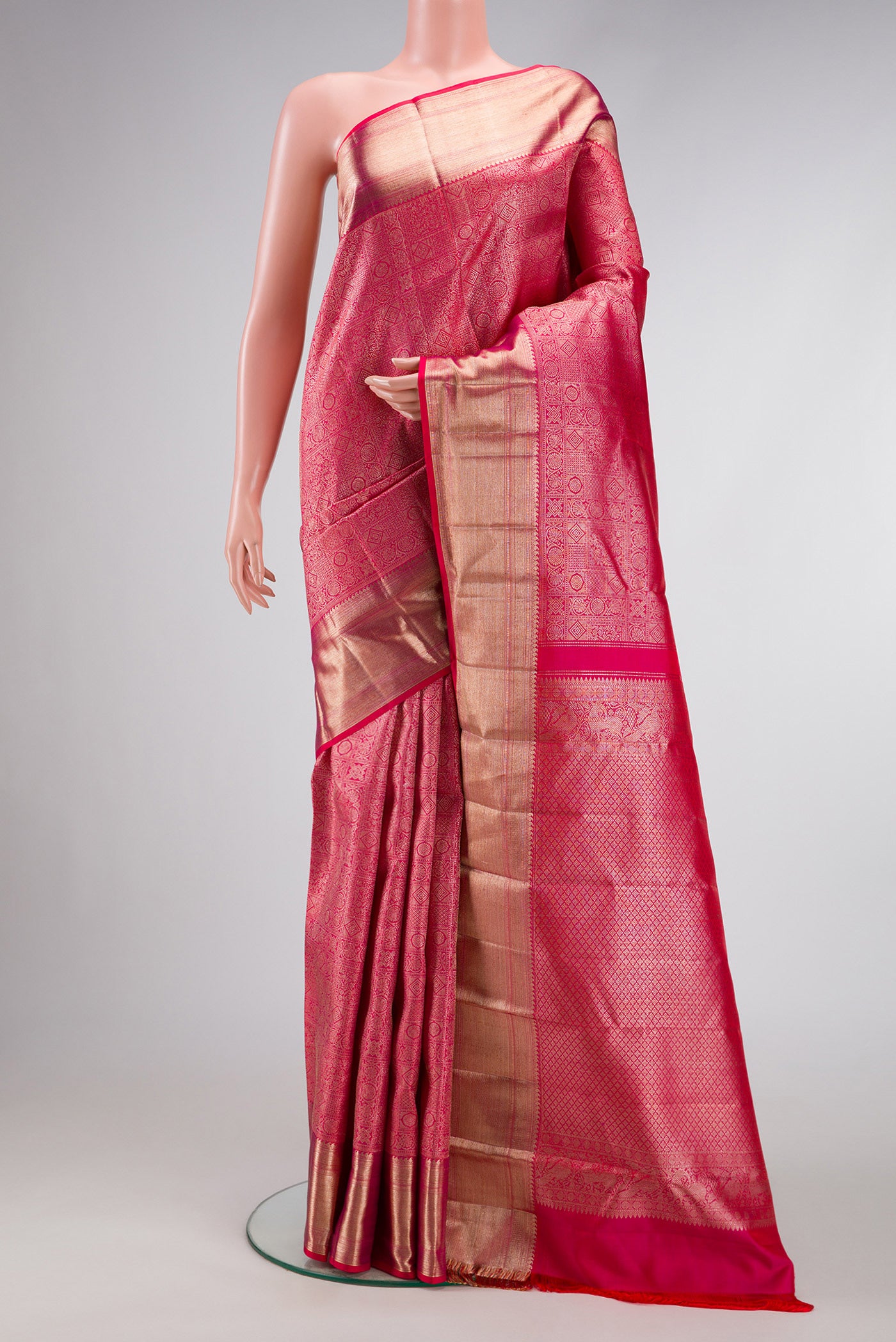 Pink Dual Tone Kanchipuram Silk Saree with Zari Brocade on the body and Zari Border.  displayed on a mannequin