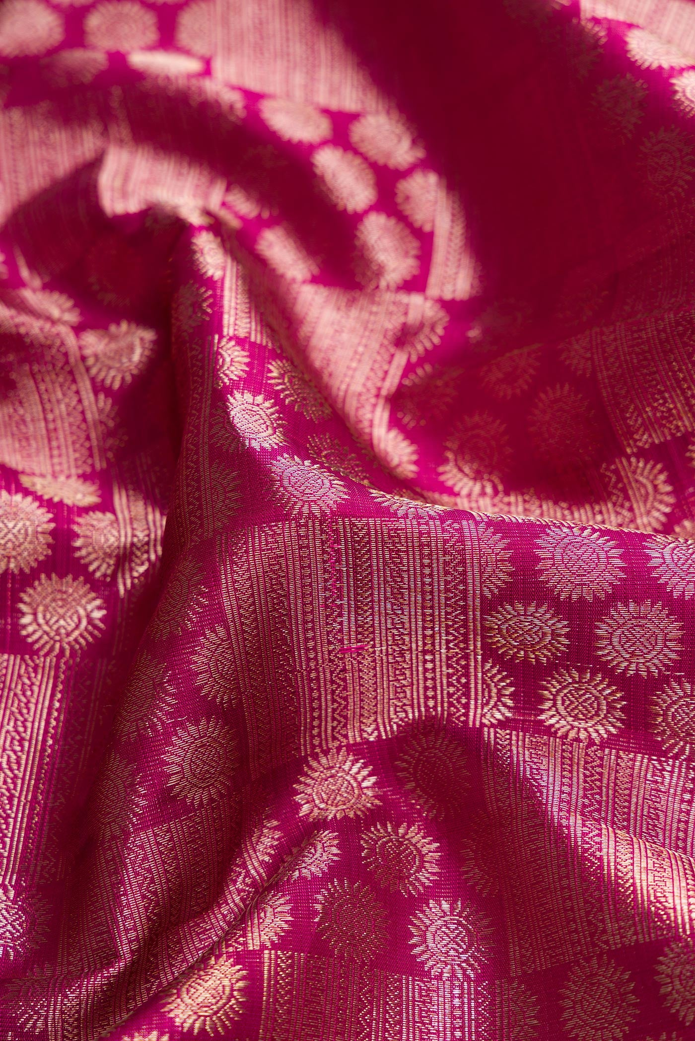 Close up of Purple Dual Tone Kanchipuram Silk Saree with Zari Brocade on the body and Zari Border.  displaying folds