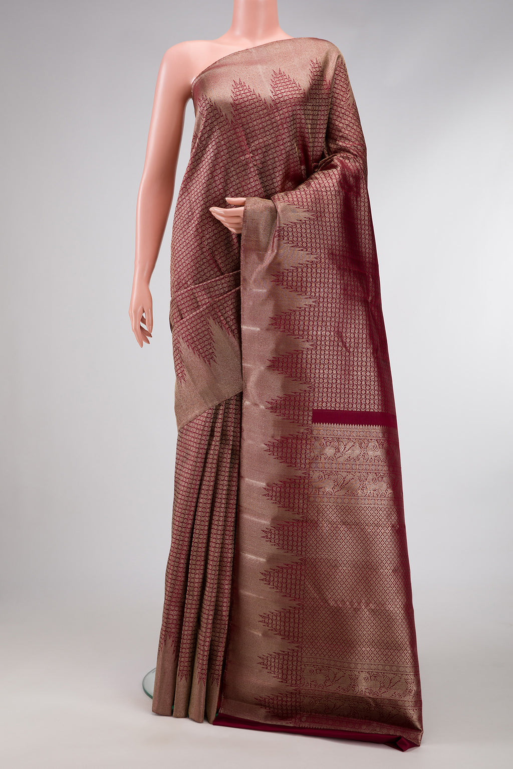 Maroon Dual Tone Kanchipuram Silk Saree with Zari Brocade on the body and Zari Border.  displayed on a mannequin