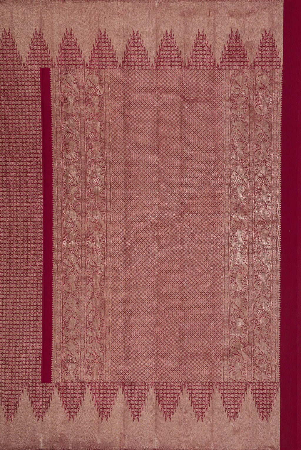 Close up image of the pallu of Maroon Dual Tone Kanchipuram Silk Saree with Zari Brocade on the body and Zari Border. 