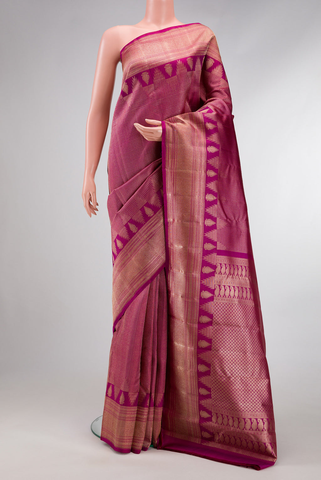 Magenta Dual Tone Kanchipuram Silk Saree with Zari Brocade on the body and Fancy Border.  displayed on a mannequin