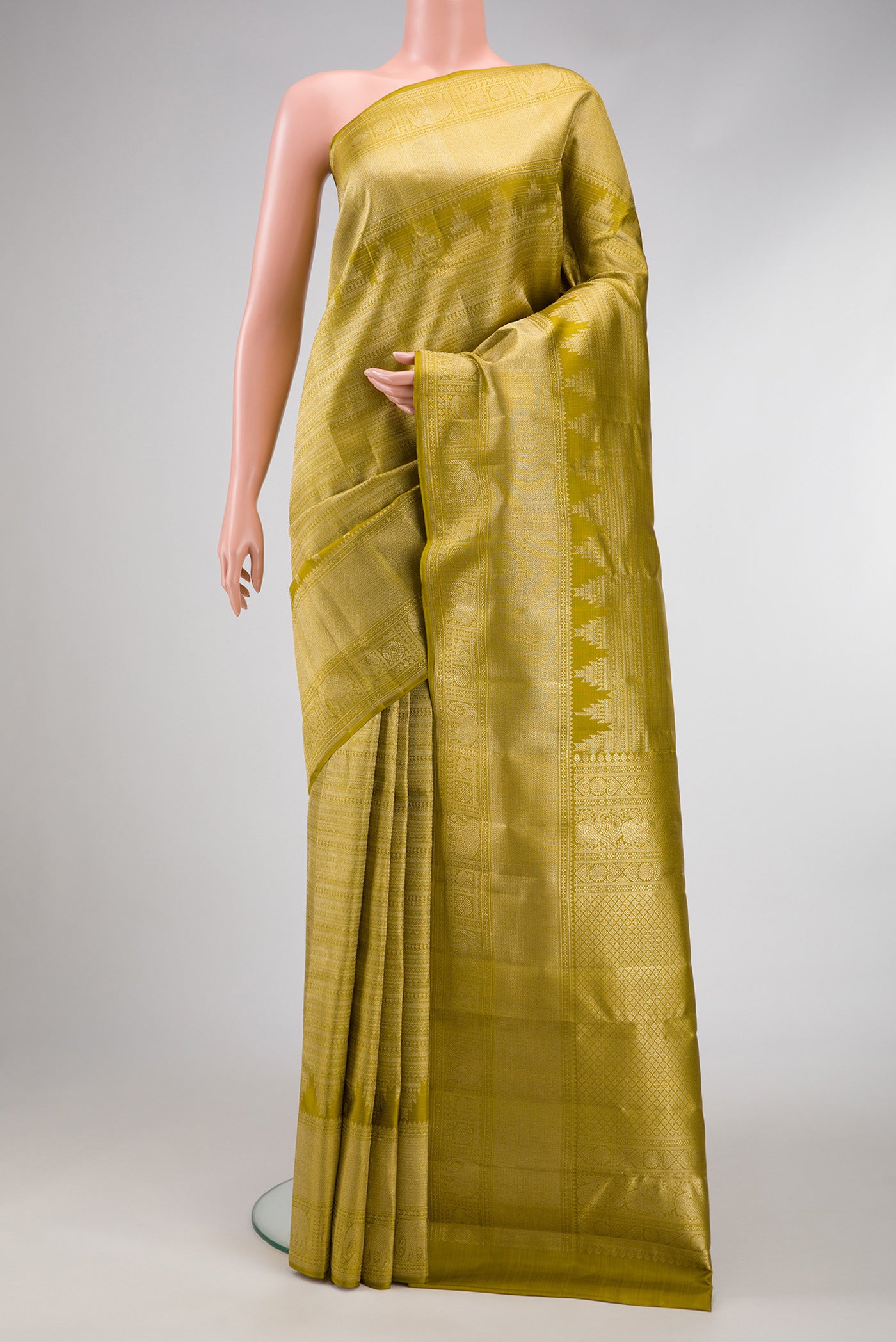 Mehandi Green Dual Tone Kanchipuram Silk Saree with Zari Brocade on the body and Zari Border.  displayed on a mannequin
