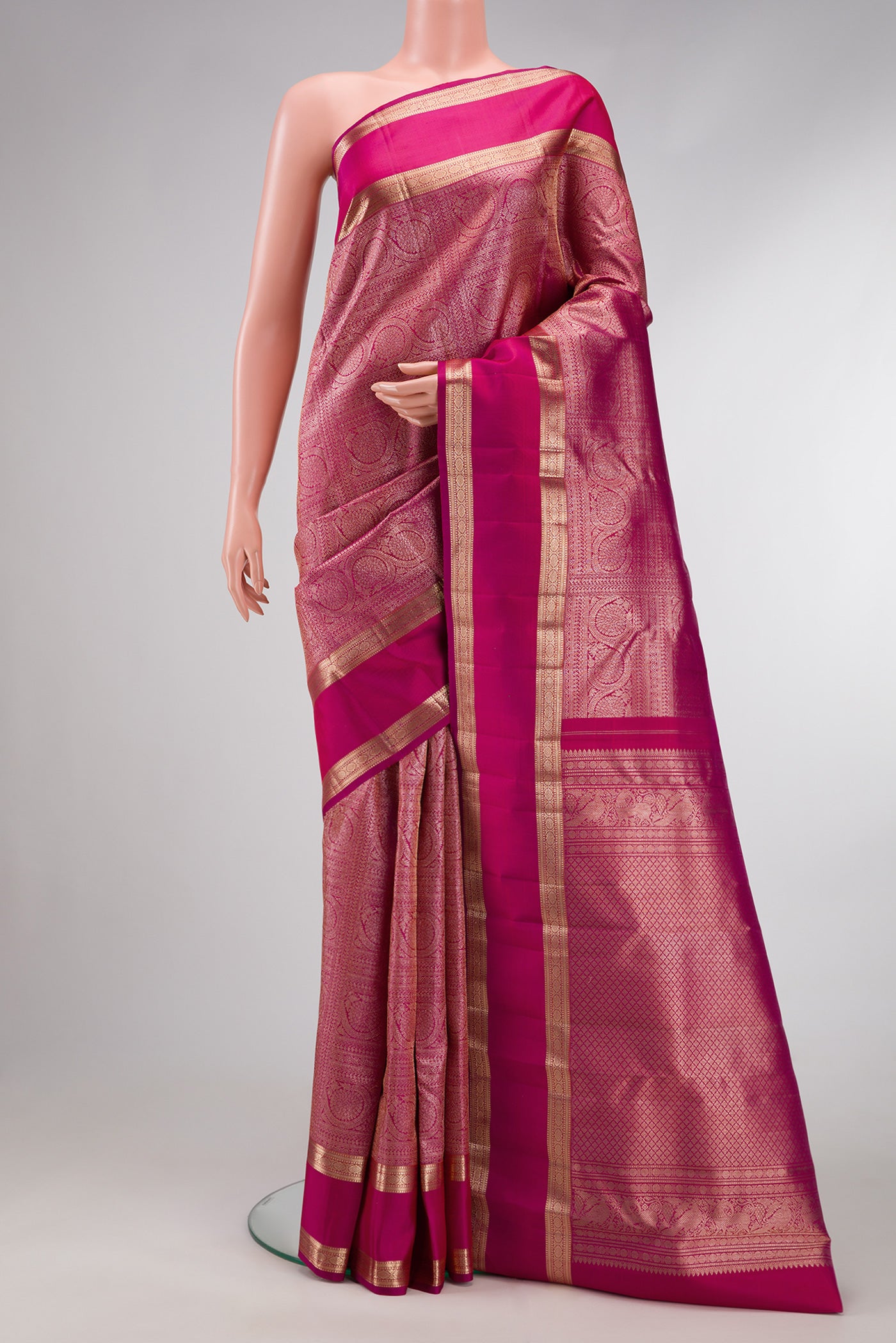 Pink Dual Tone Kanchipuram Silk Saree with Zari Brocade on the body and Zari Border.  displayed on a mannequin