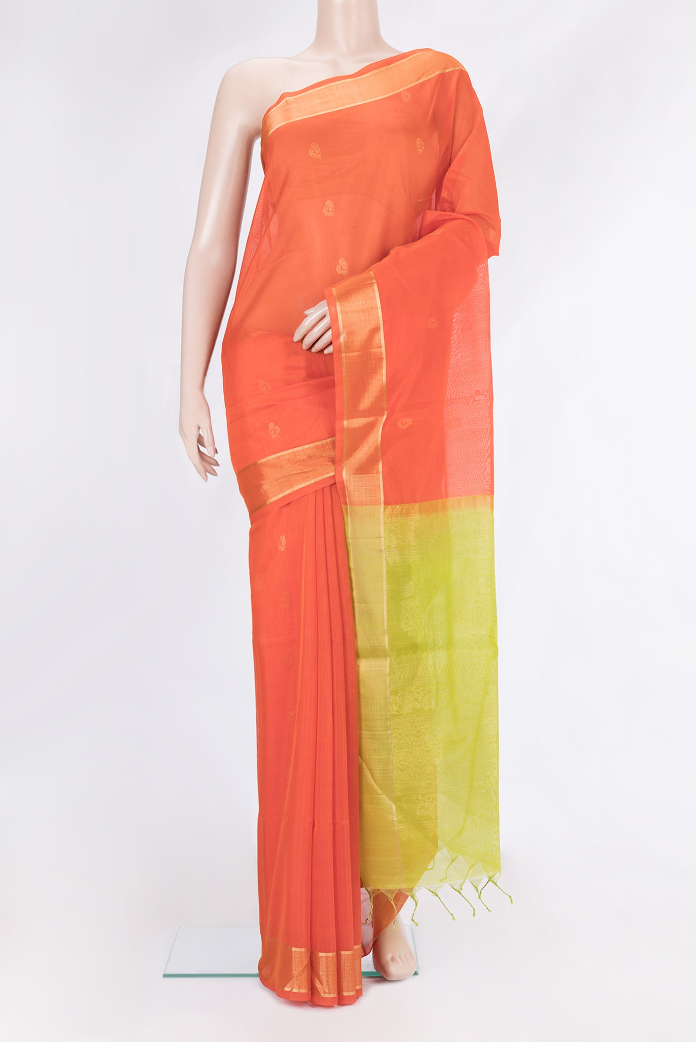 Orange Silk Cotton Saree with Zari Butta on the body and Zari Border.  displayed on a mannequin