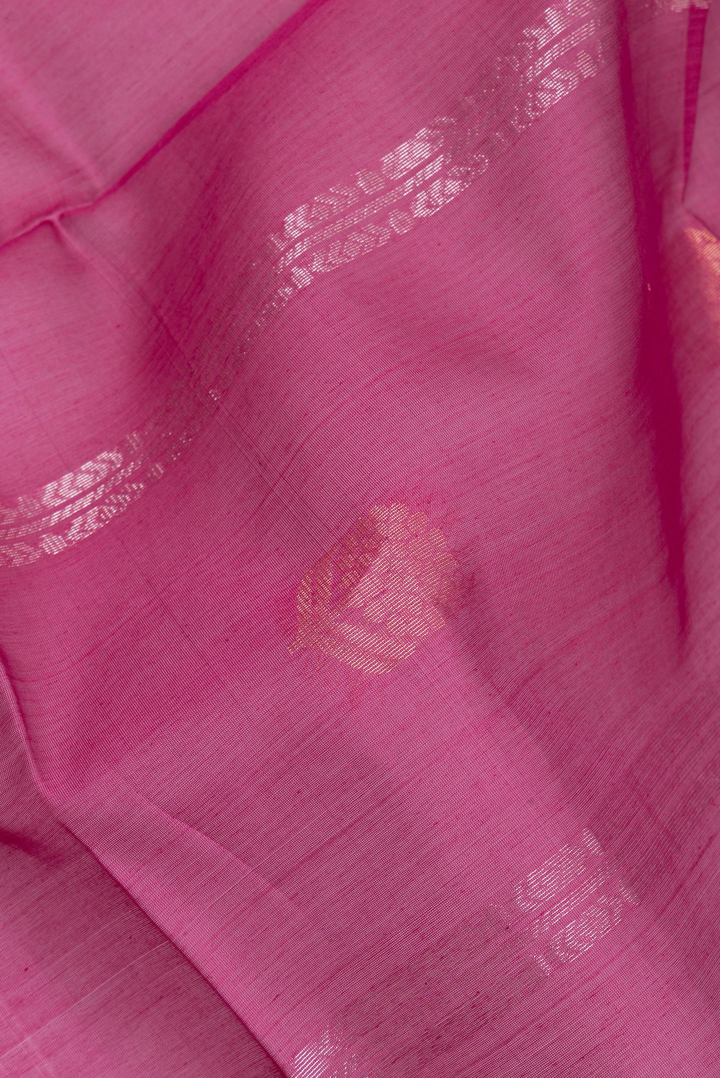 Close up of Magenta Silk Cotton Saree with Zari Butta on the body and Zari Border.  displaying folds