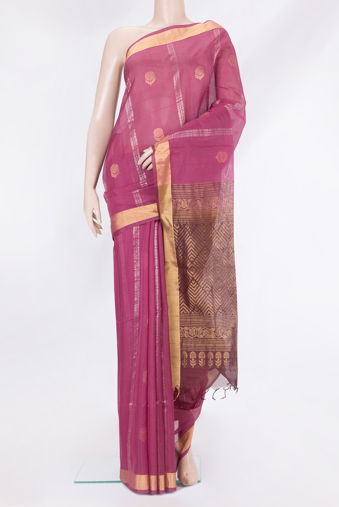 Magenta Silk Cotton Saree with Zari Butta on the body and Zari Border.  displayed on a mannequin