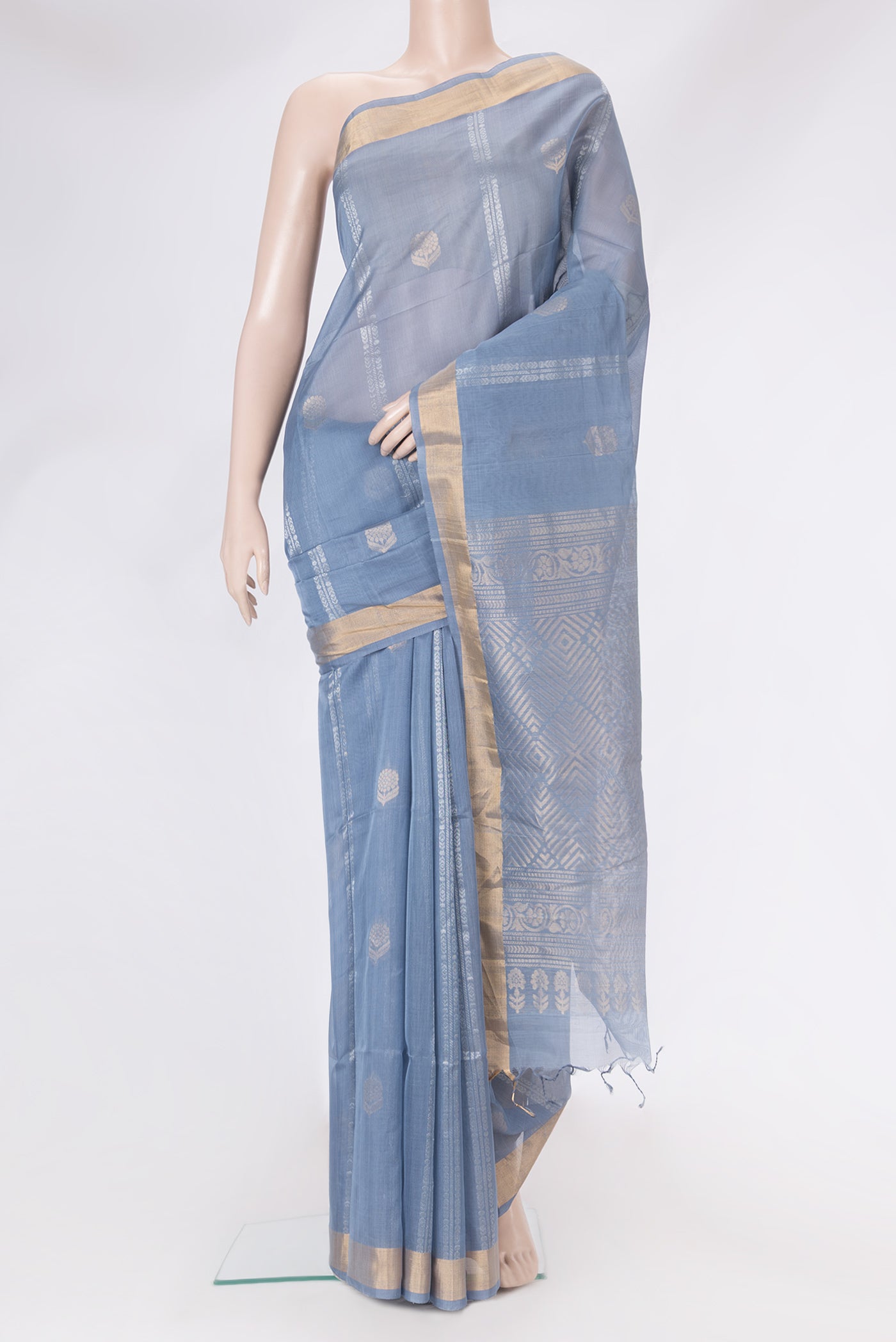 Blue Silk Cotton Saree with Zari Butta on the body and Zari Border.  displayed on a mannequin