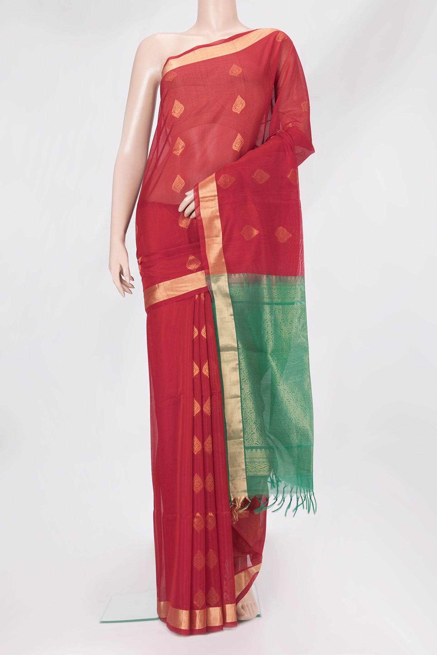 Red Silk Cotton Saree with Zari Butta on the body and Zari Border.  displayed on a mannequin