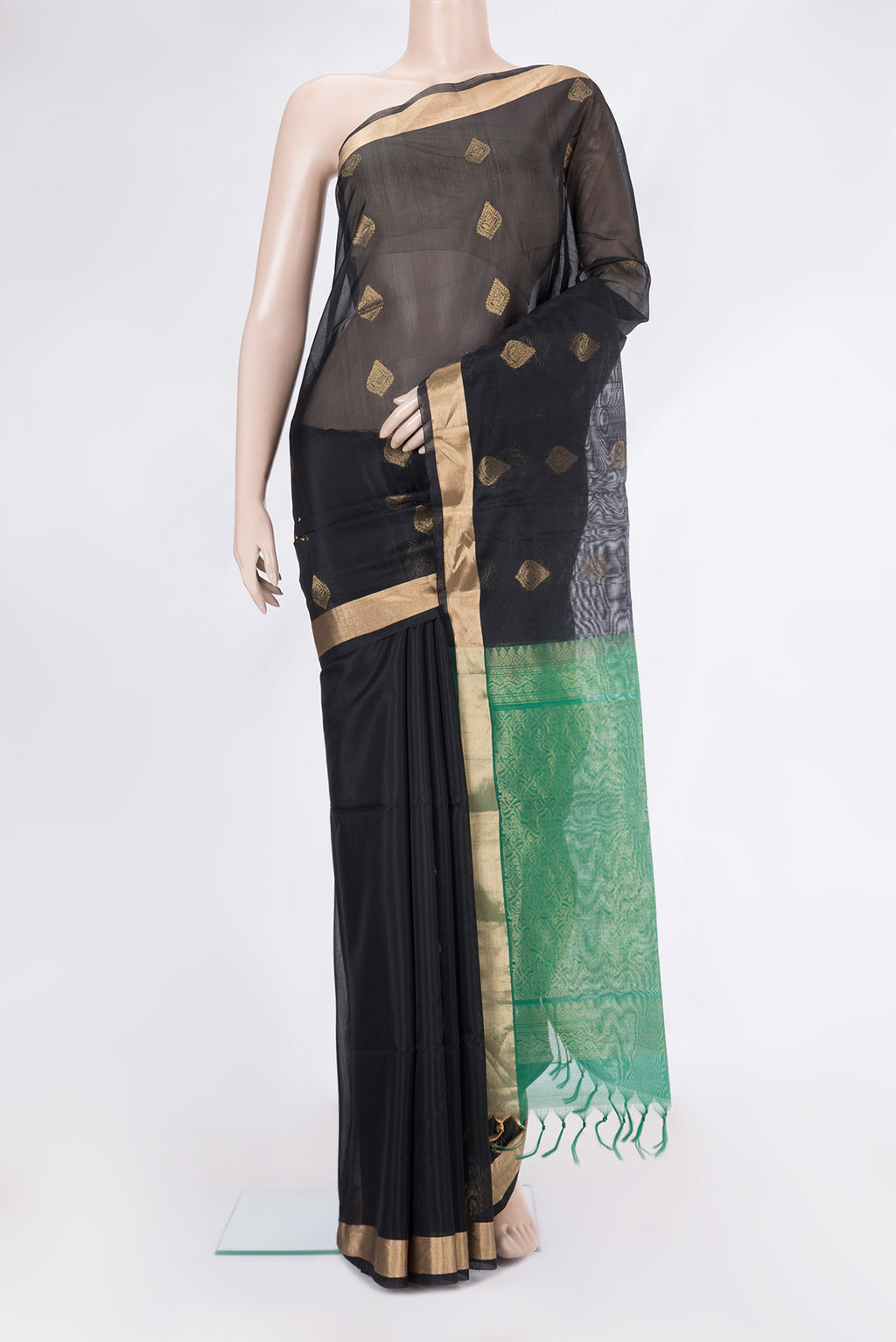 Black Silk Cotton Saree with Zari Butta on the body and Zari Border.  displayed on a mannequin
