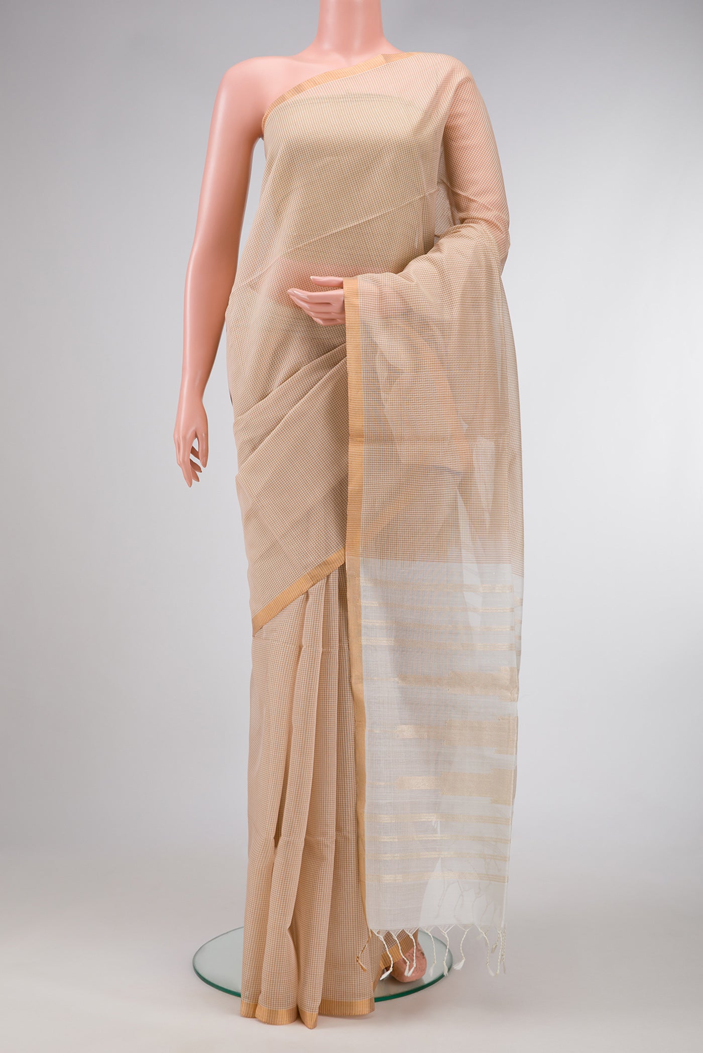 Beige Dual Tone Maheshwari Silk Saree with Checked design on the body and Zari Border.  displayed on a mannequin