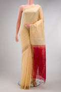 Sandal Silk Cotton Saree with Zari Butta on the body and Zari Border.  displayed on a mannequin