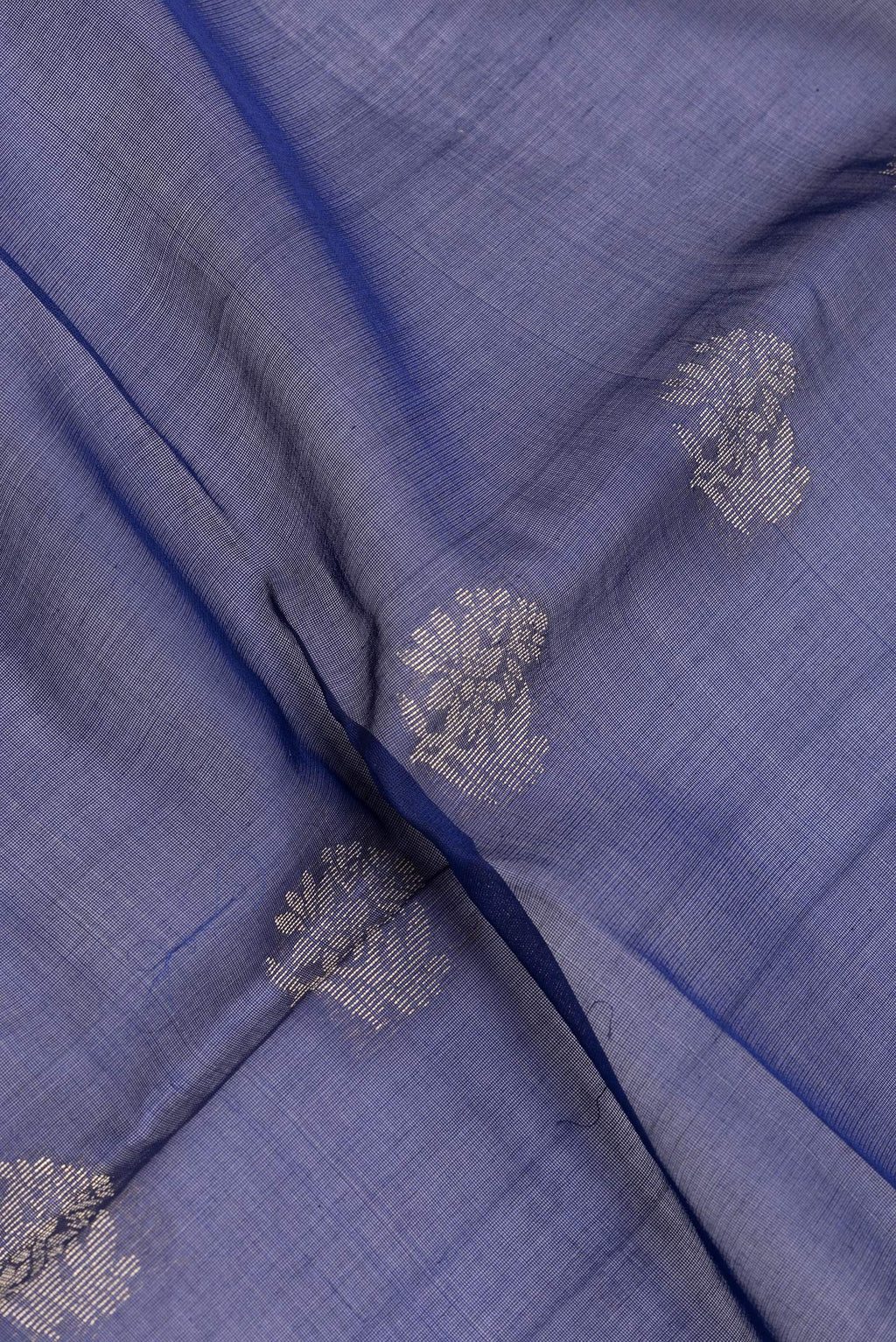Close up of Navy Blue Silk Cotton Saree with Zari Butta on the body and Zari Border.  displaying folds