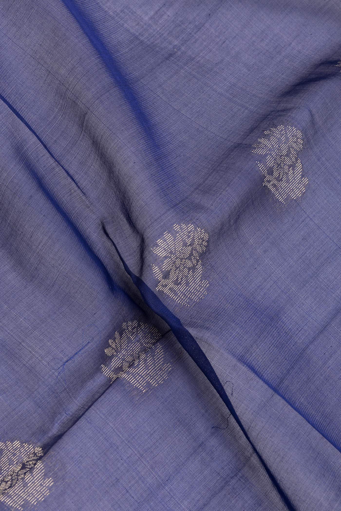 Close up of Navy Blue Silk Cotton Saree with Zari Butta on the body and Zari Border.  displaying folds