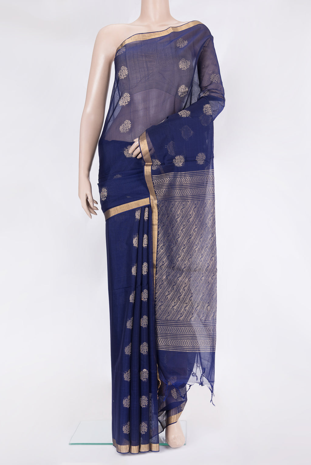 Navy Blue Silk Cotton Saree with Zari Butta on the body and Zari Border.  displayed on a mannequin