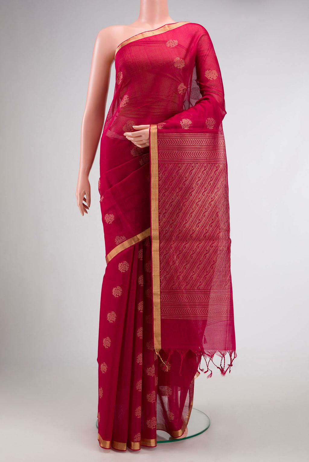 Maroon Dual Tone Silk Cotton Saree with Zari Butta on the body and Zari Border.  displayed on a mannequin