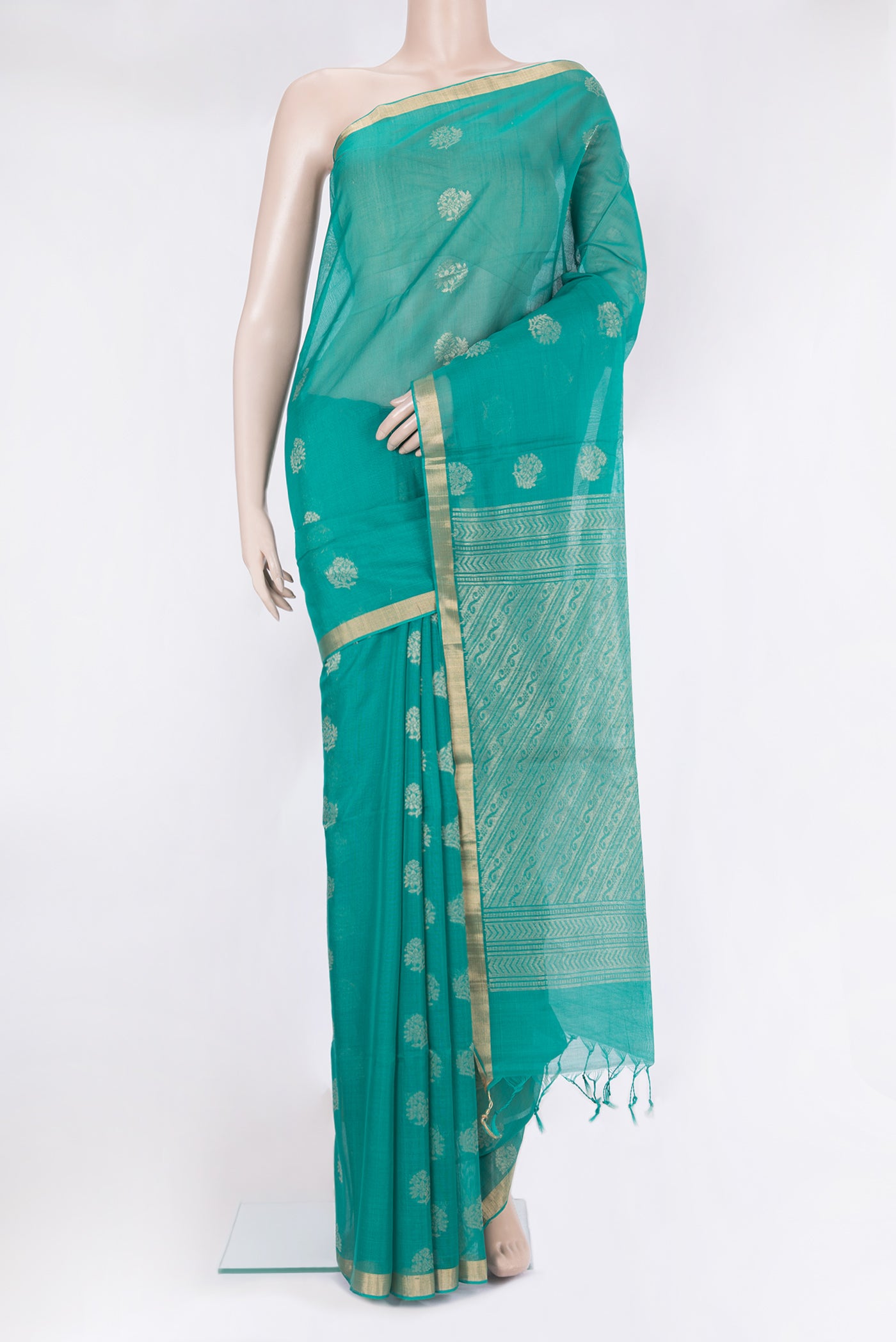 Green Silk Cotton Saree with Zari Butta on the body and Zari Border.  displayed on a mannequin