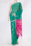 Green Silk Cotton Saree with Zari Butta on the body and Zari Border.  displayed on a mannequin