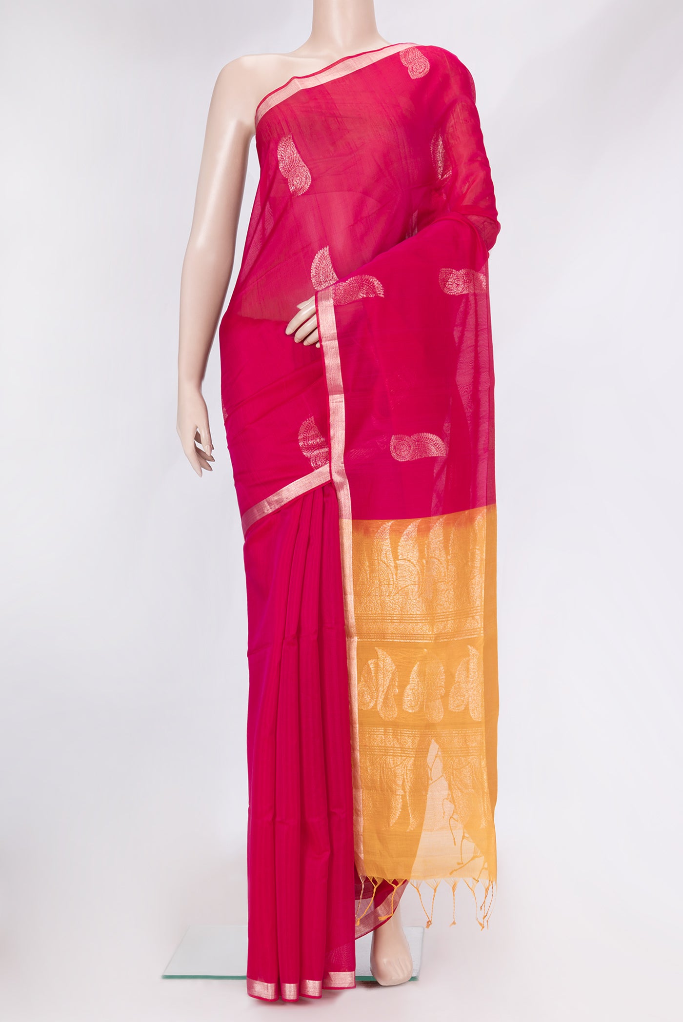 Dark Pink Dual Tone Silk Cotton Saree with Zari Butta on the body and Zari Border.  displayed on a mannequin