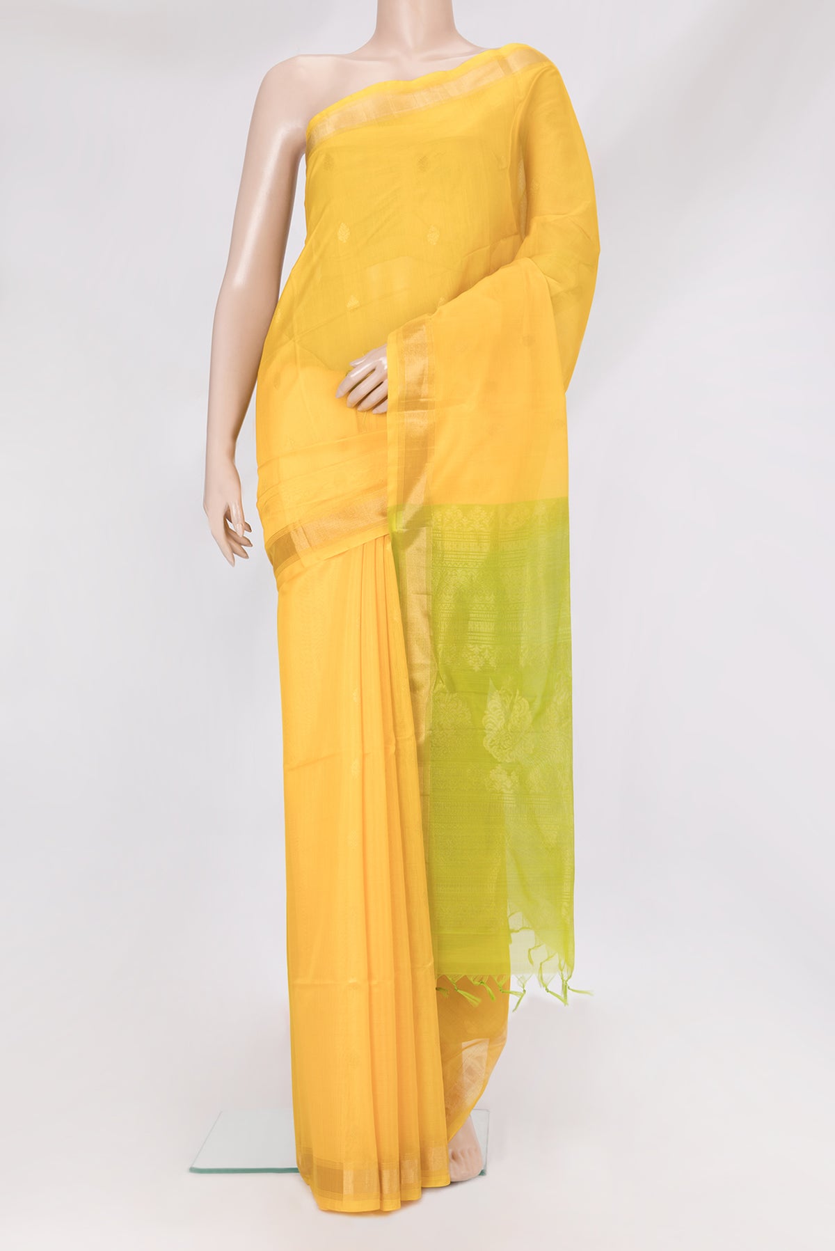 Yellow Silk Cotton Saree with Zari Butta on the body and Zari Border.  displayed on a mannequin