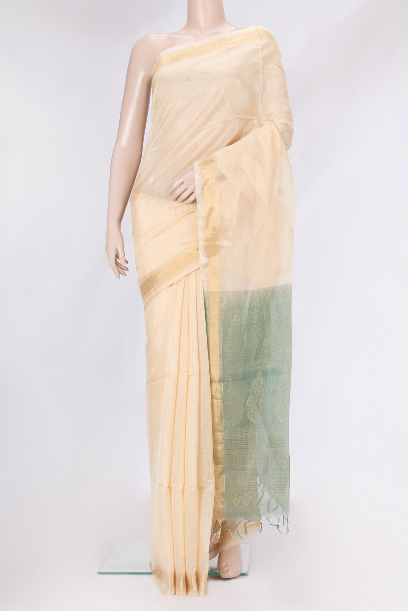 Sandal Dual Tone Silk Cotton Saree with Zari Butta on the body and Zari Border.  displayed on a mannequin