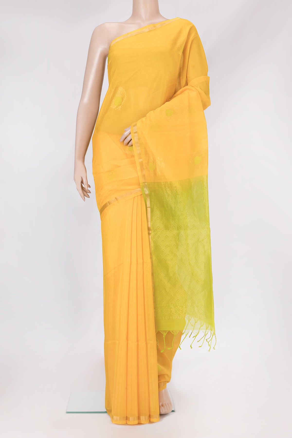 Yellow Silk Cotton Saree with Zari And Thread Butta on the body and Zari Border.  displayed on a mannequin