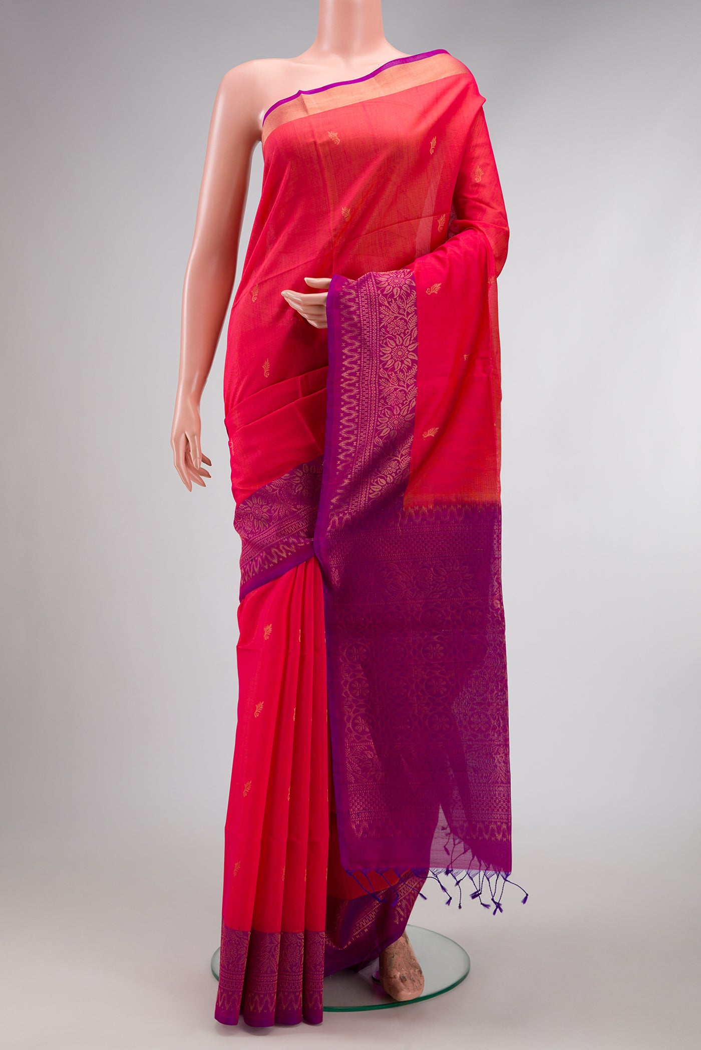 Pink Silk Cotton Saree with Zari Butta on the body and Zari Border.  displayed on a mannequin