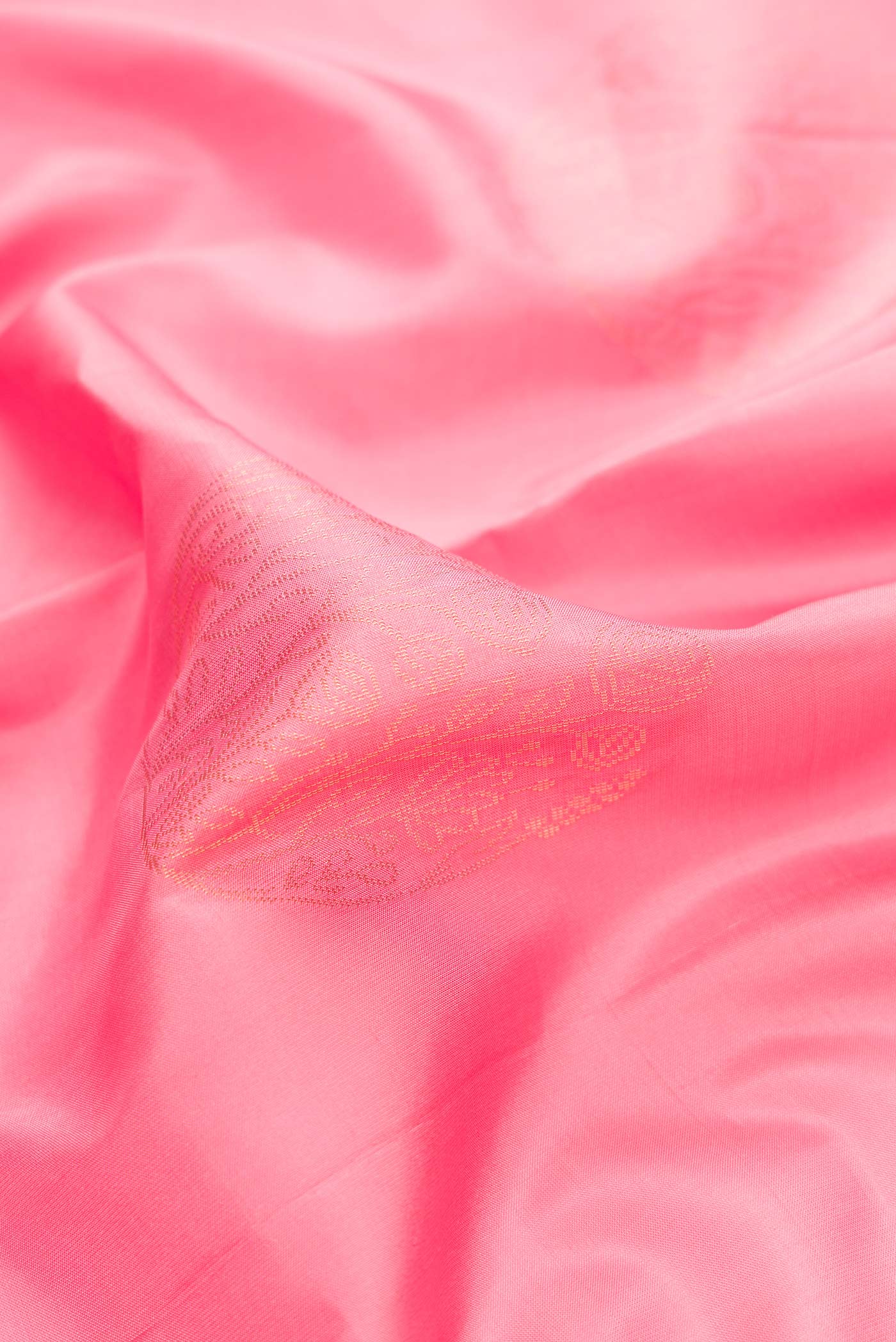 Close up of Pink Dual Tone Soft Silk Saree with Zari Butta on the body and Zari Border.  displaying folds