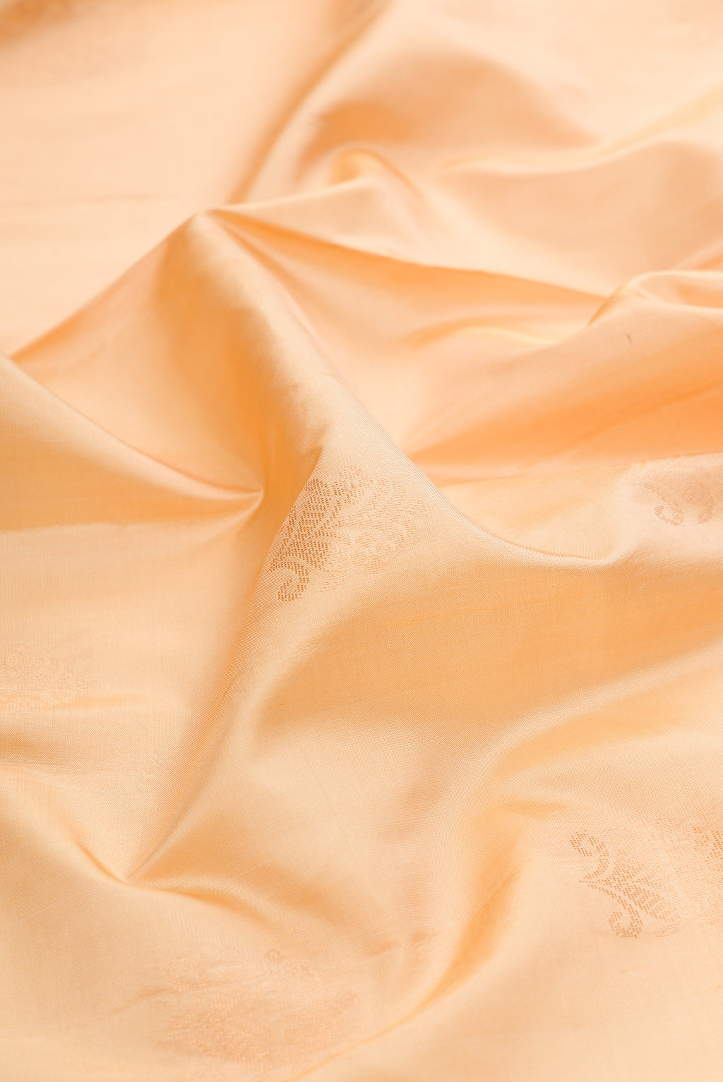 Close up of Sandal Dual Tone Soft Silk Saree with Zari Butta on the body and Zari Border.  displaying folds