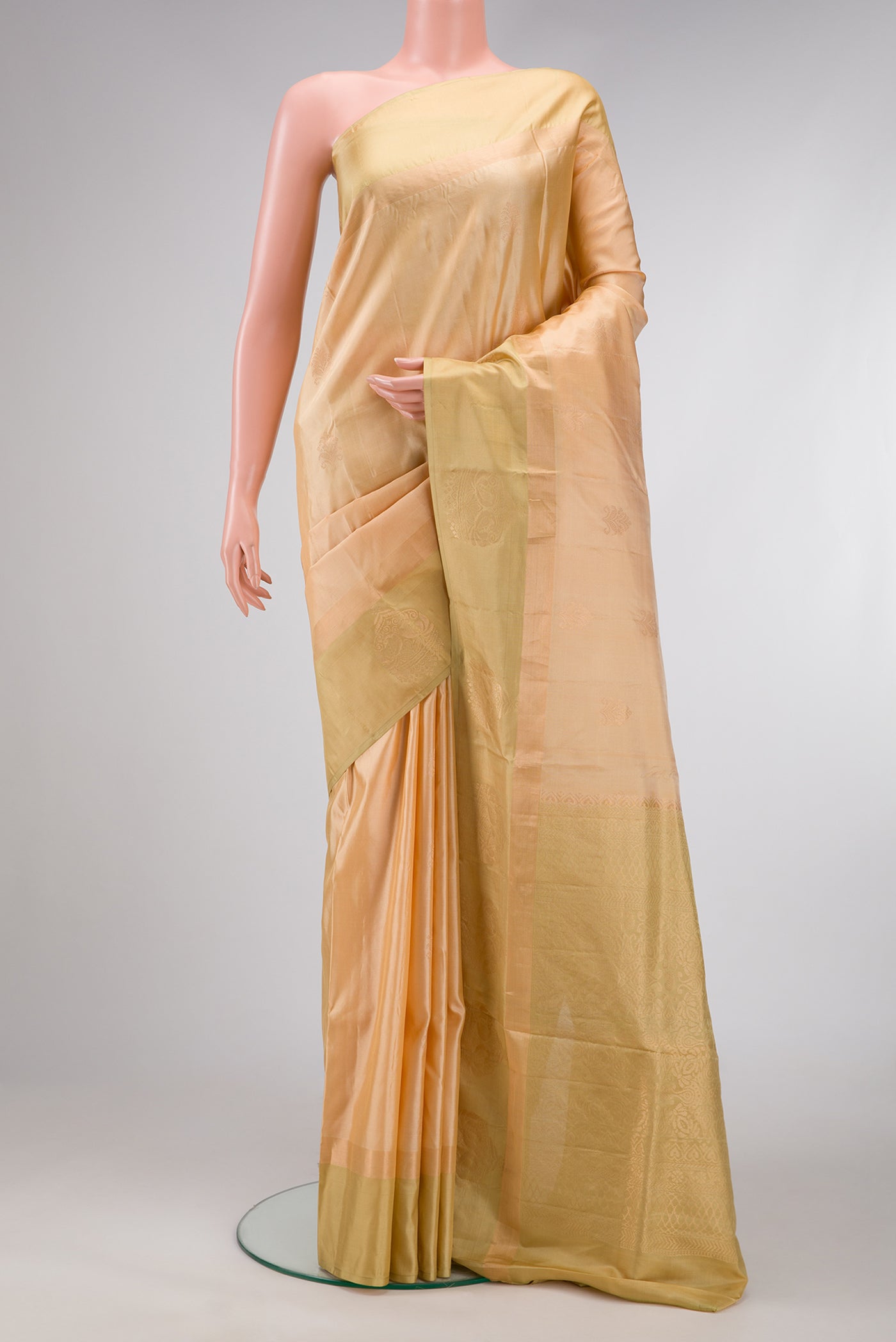 Sandal Dual Tone Soft Silk Saree with Zari Butta on the body and Zari Border.  displayed on a mannequin