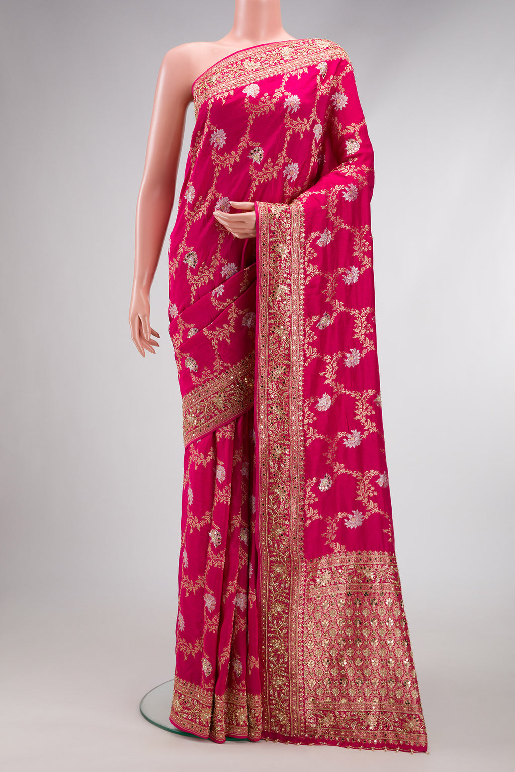 Pink Dual Tone Georgette Saree with Zari Brocade on the body and Embroidery Border.  displayed on a mannequin