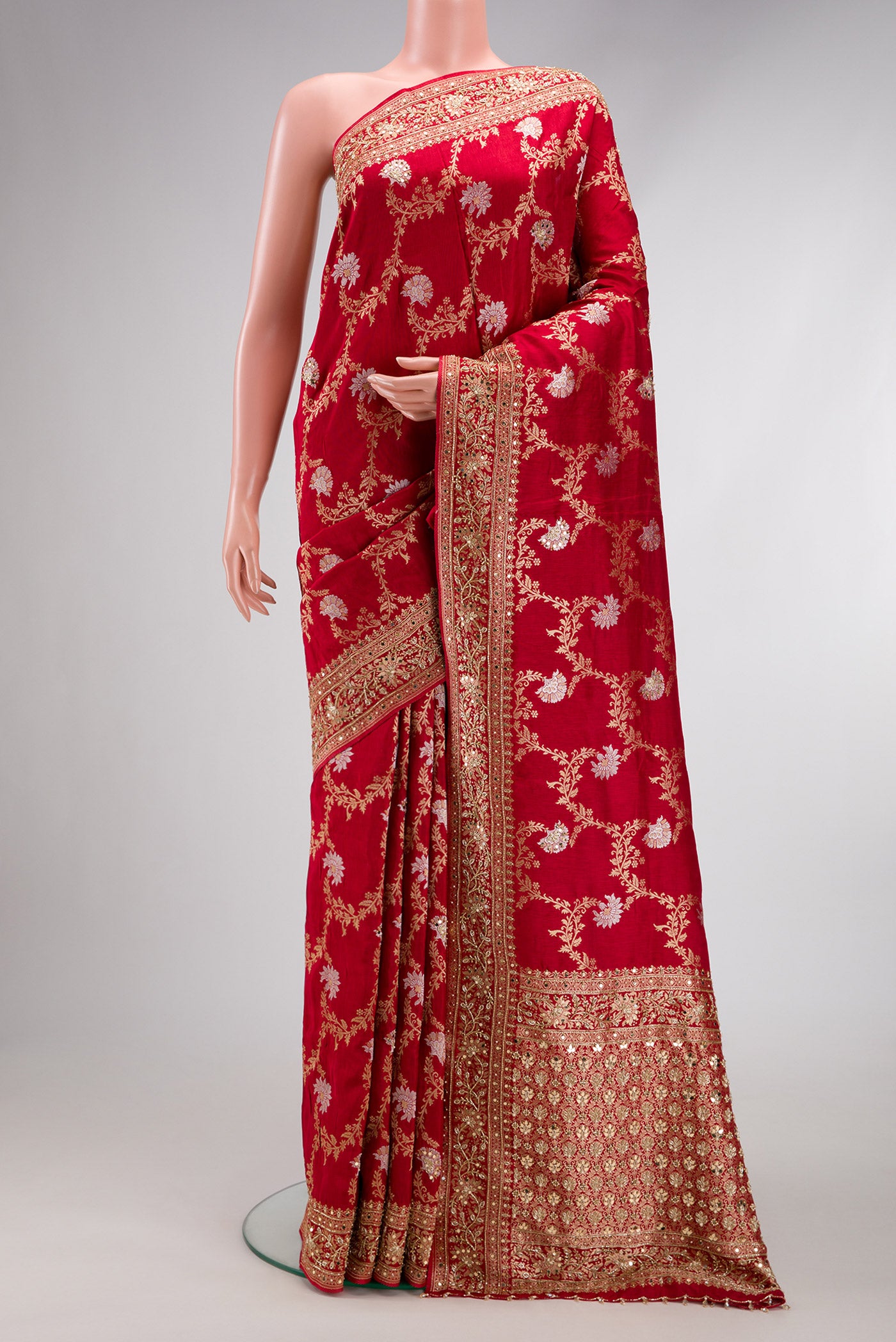 Red Dual Tone Georgette Saree with Zari Brocade on the body and Embroidery Border.  displayed on a mannequin