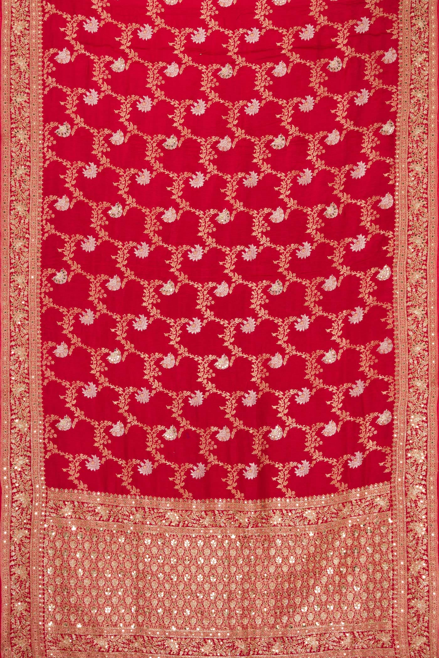 Flat view of Red Dual Tone Georgette Saree with Zari Brocade on the body and Embroidery Border. 