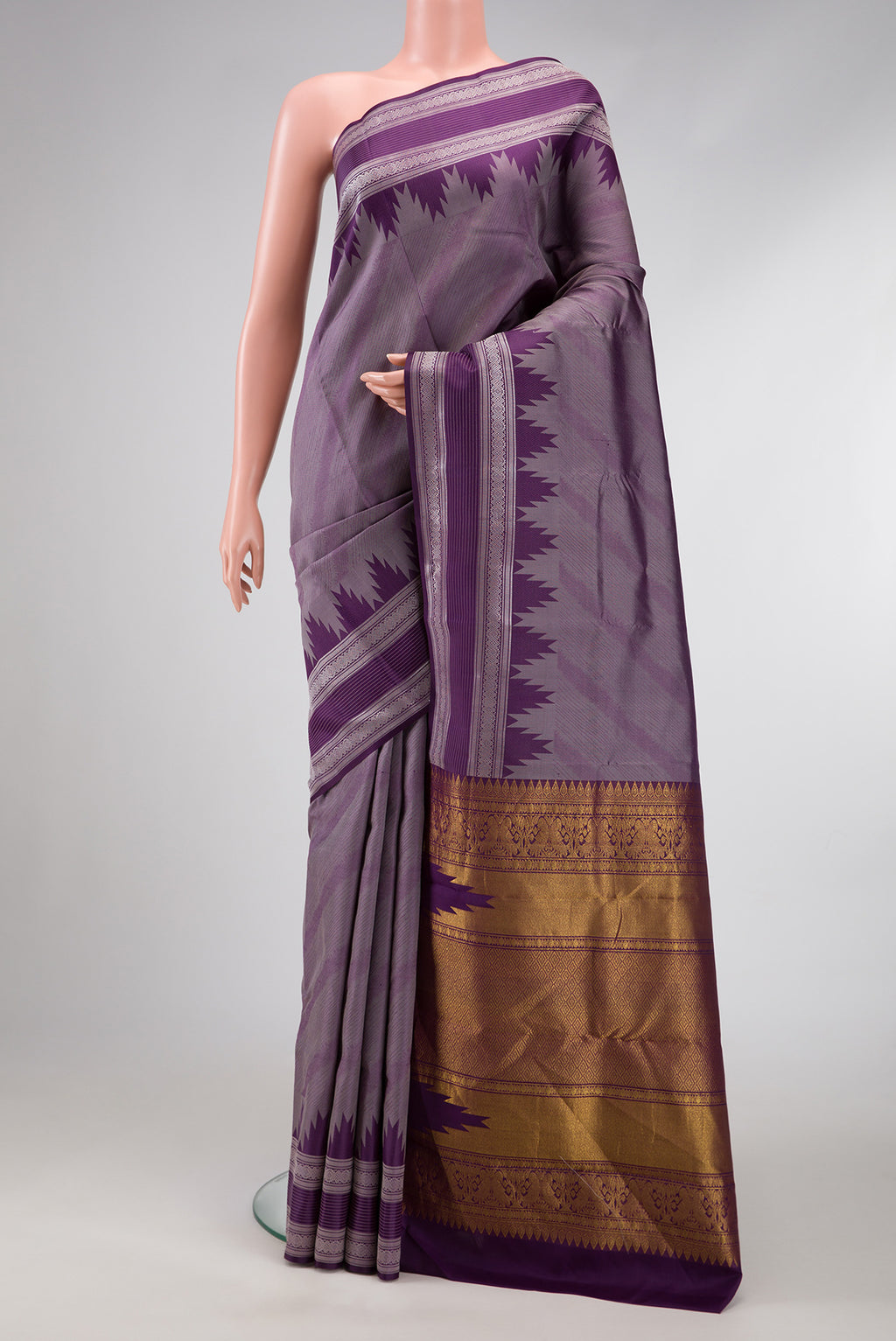 Burgundy Dual Tone Kanchipuram Silk Saree with Jacquard design on the body and Temple Border.  displayed on a mannequin
