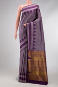 Burgundy Dual Tone Kanchipuram Silk Saree with Jacquard design on the body and Temple Border.  displayed on a mannequin